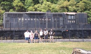 group portrait in front of a train